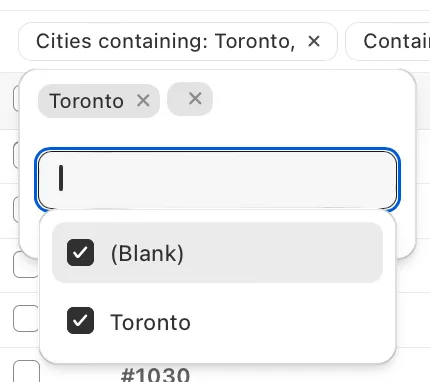 A Cities containing: Toronto filter open, with Toronto and (Blank) ticked in the checkbox list below the text box