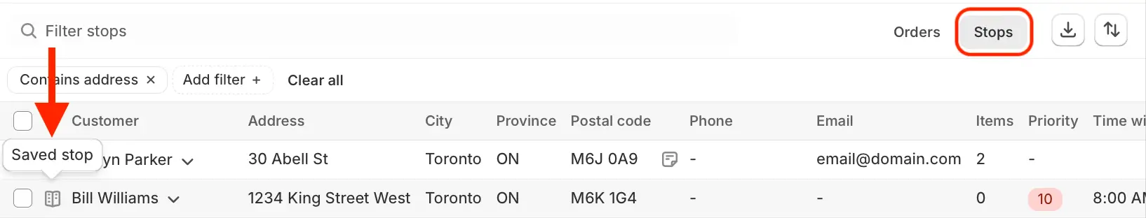 The stops table with the Stops tab highlighted, an arrow pointing to a Saved stop marker beside a customer