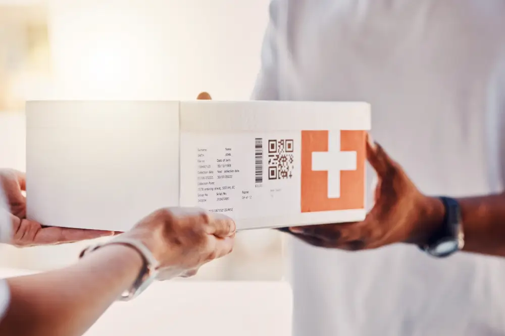 A labelled white box marked with a medical cross passing between two people