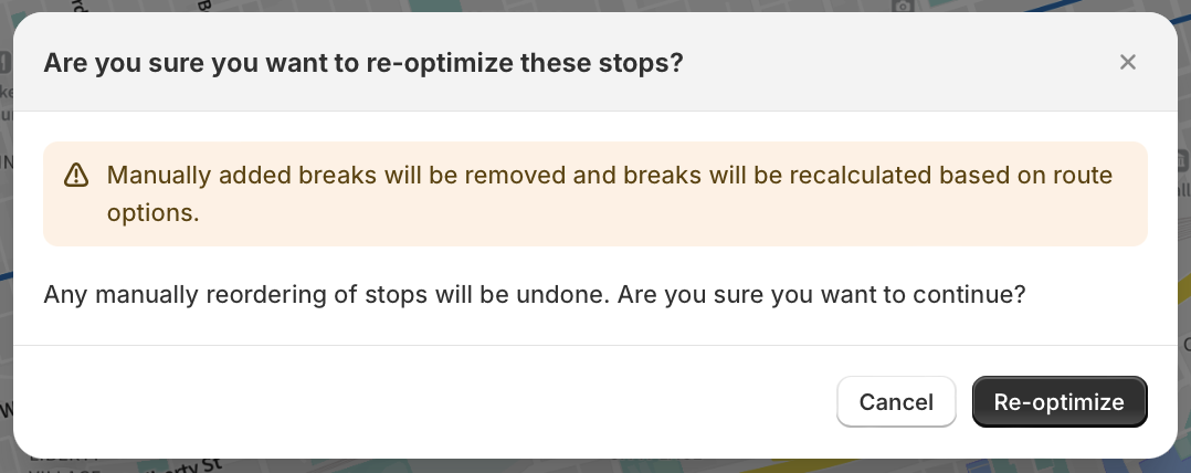 The re-optimize confirmation dialog warning that manually added breaks will be removed and recalculated based on route options